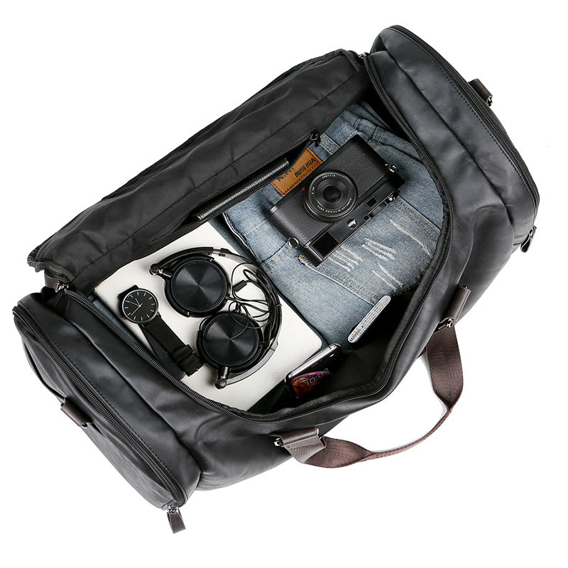 PU leather extra-large capacity travel bag, men's business trip duffle bag, travel backpack, Korean version of the hand-held shoulder enlarged