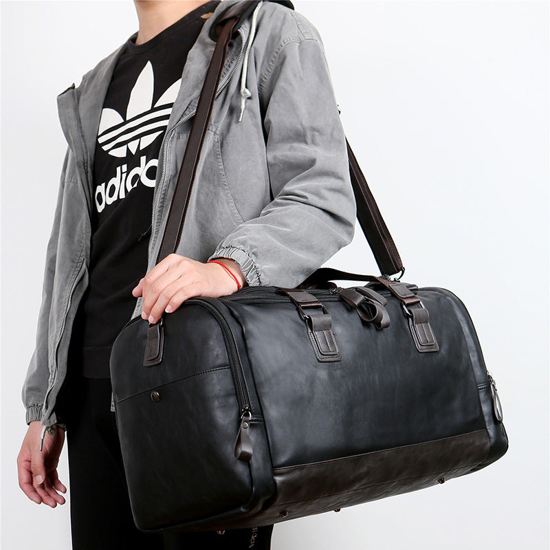 PU leather extra-large capacity travel bag, men's business trip duffle bag, travel backpack, Korean version of the hand-held shoulder enlarged