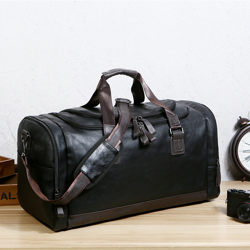 PU leather extra-large capacity travel bag, men's business trip duffle bag, travel backpack, Korean version of the hand-held shoulder enlarged