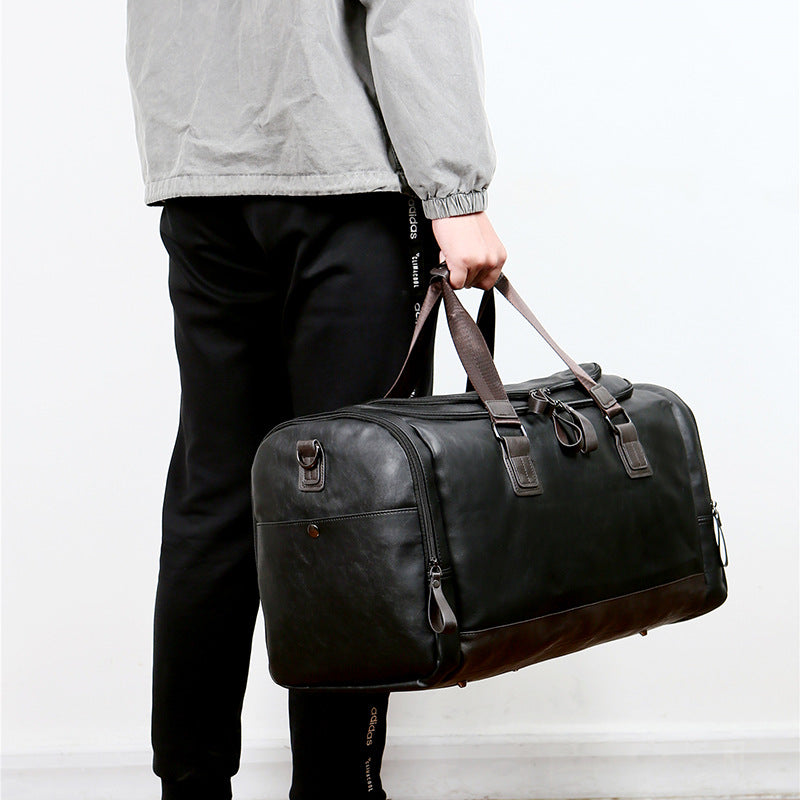 PU leather extra-large capacity travel bag, men's business trip duffle bag, travel backpack, Korean version of the hand-held shoulder enlarged