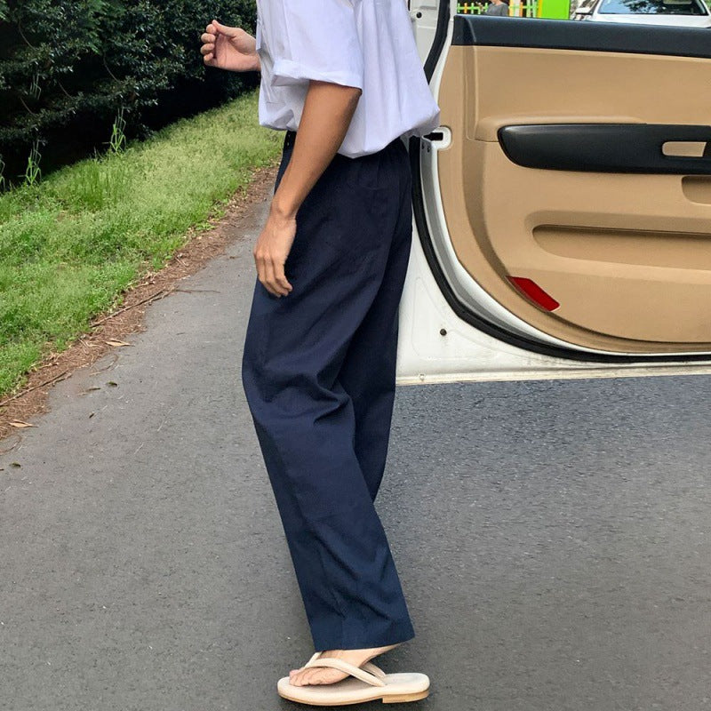 Wide-Leg Pleated Trousers