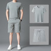 The shorts suit is light gray