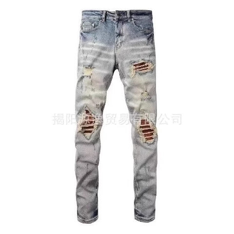 AMIRI Distressed Embroidered Jeans
