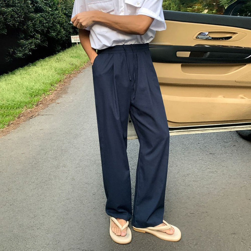 Wide-Leg Pleated Trousers