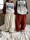 Off-white straight-leg pants (one white button)