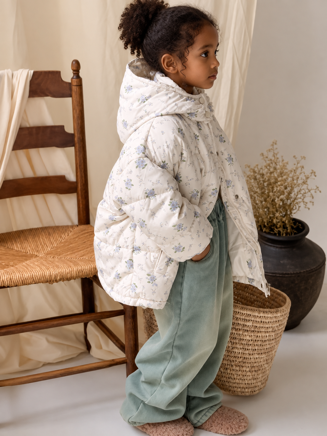Floral hooded down jacket on Ethiopian child model