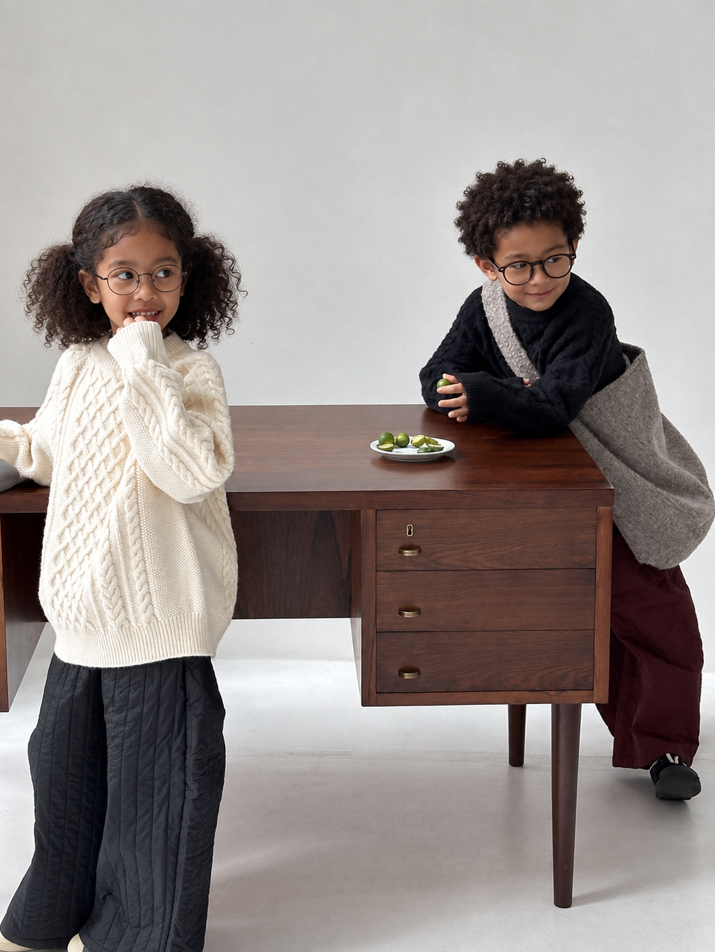 Solid-color cable-knit sweater on Ethiopian child models